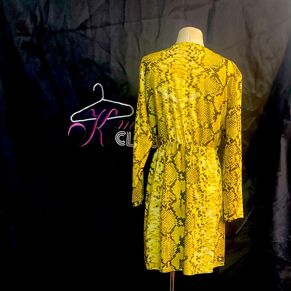 Cute nice yellow snake print dress u can dress it up is down very nice material